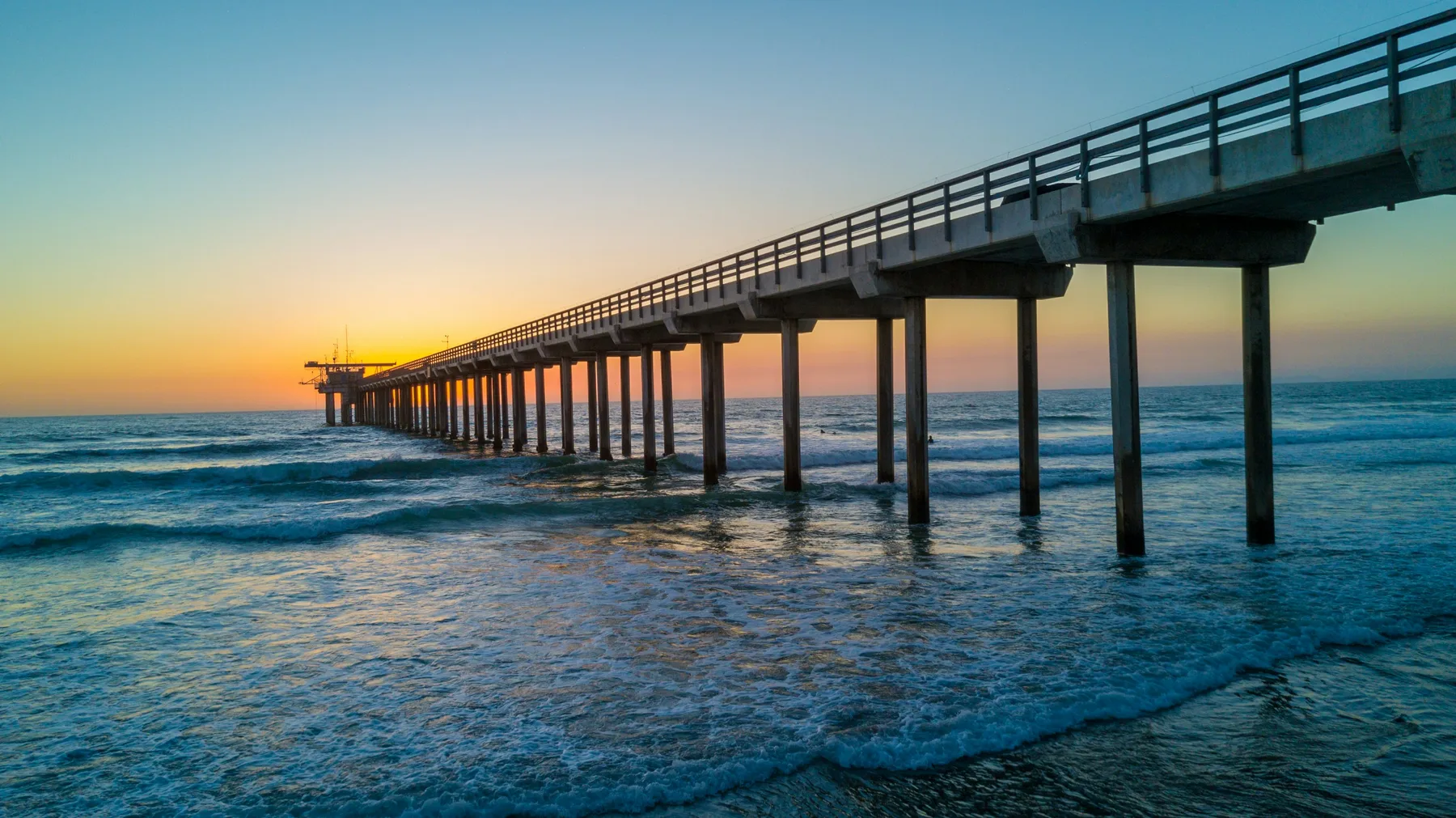 Scripps Pier extending over the Pacific at dusk